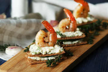 Appetizer canape with shrimp and cucumber