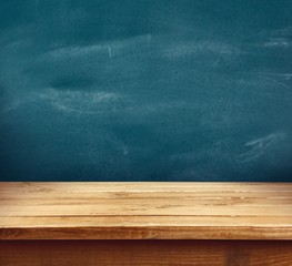 Wooden. Empty wooden table over grunge cement wall, vintage