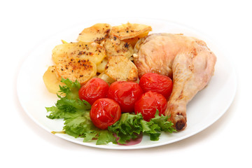 fried chicken leg with potatoes and marinated tomatoes