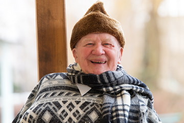 Closeup profile on eldelry man in winter