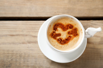 Cup of coffee on old wooden table