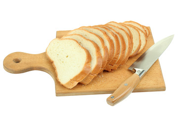 sliced bread on a board and knife isolated on white background