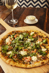 fresh baked ridgeback shrimp pizza with a glass of chardonnay wi