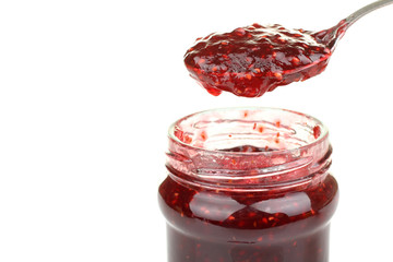 spoon in a jar of jam isolated