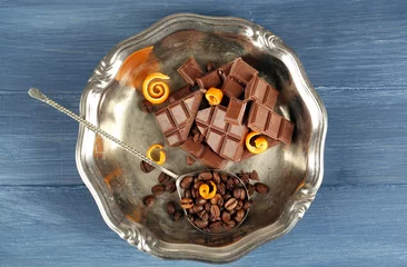 Fotobehang Chocolate with orange peels and coffee beans in metal tray © Africa Studio