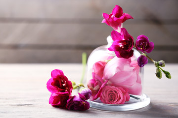 Beautiful composition with flowers on grey wooden  background
