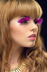 Beauty portrait with pink false eyelashes