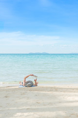 Fototapeta na wymiar Summer, Travel, Vacation and Holiday concept - Man resting on be