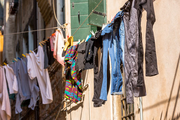 Venetian windows with the laundry drying on a wire