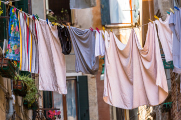 Venetian windows with the laundry drying on a wire
