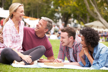 Older Family Relaxing At Outdoor Summer Event