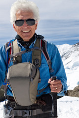 Active senior man hiking in the snowy mountains - 80883399