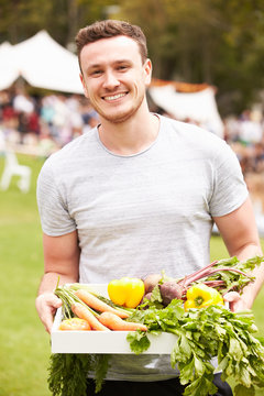 Man With Fresh Produce Bought At Outdoor Farmers Market