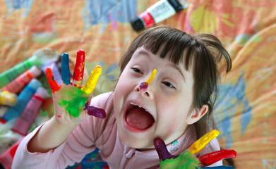 Cute little girl with painted hands
