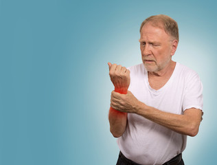 senior man in excruciating hand ache painful wrist arthritis