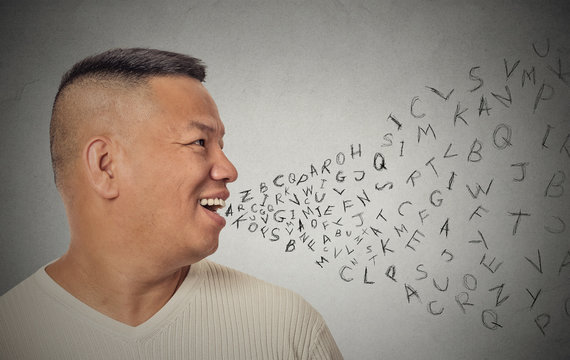 man talking with alphabet letters coming out of open mouth