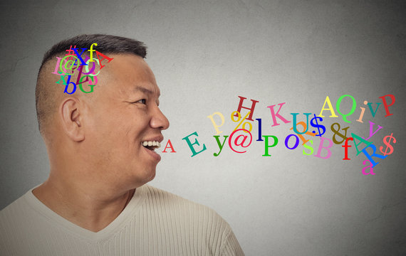 man talking with alphabet letters coming out of open mouth
