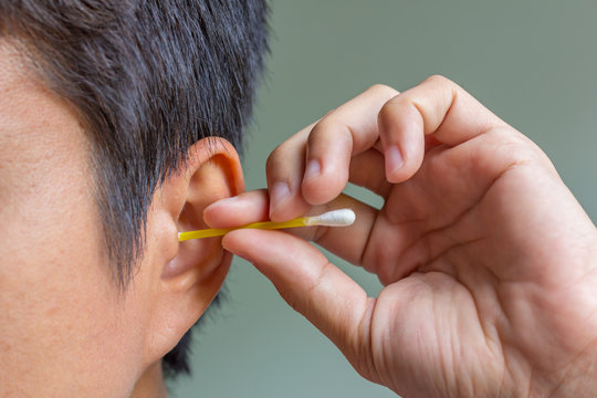 Cleaning Ear With Cotton Bud