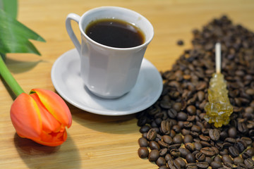 coffee, coffee beans, fresh flower and sugar stick