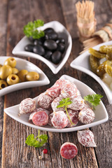 buffet food with sausage and olives