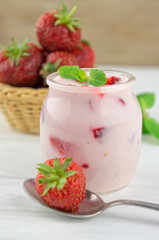 Strawberry yogurt  with fresh fruits and mint leaves