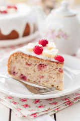 Banana Cake with Sugar Glaze Topped with Raspberries and Banana