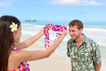 Hawaii woman giving lei garland welcoming tourist © Maridav