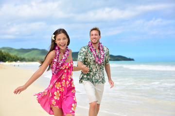 Fun couple on beach vacations in Hawaiian clothing © Maridav