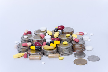 Obraz na płótnie Canvas Pill with Coins Concept