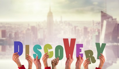 Composite image of hands holding up discovery