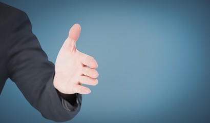 Composite image of businessman extending arm for handshake