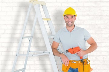 Composite image of happy handyman