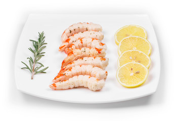 Cooked unshelled shrimps with lemon.