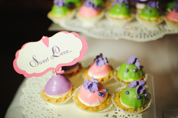 wedding dessert with delicious cakes and macaroons
