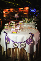 wedding dessert with delicious cakes and macaroons