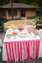 wedding dessert with delicious cakes and macaroons
