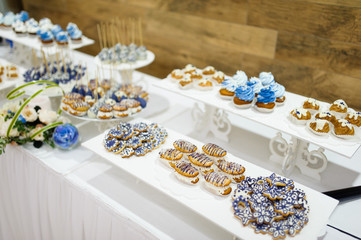 wedding dessert with delicious cakes and macaroons