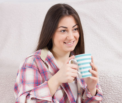 smiling young woman with cup