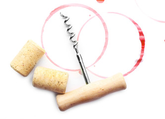 Wine stains, corks and corkscrew  isolated on white