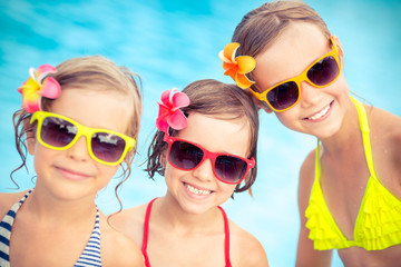 Happy children in the swimming pool