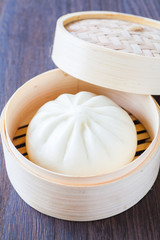 Chinese cuisines steamed bun in asian style bamboo basket