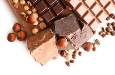Chocolate bars with hazelnuts and coffee beans isolated on