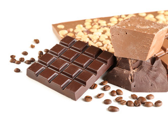Chocolate bars with hazelnuts and coffee beans isolated on