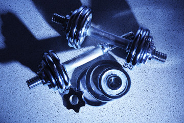 Dumbbells on floor background