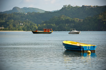View of Seychelles coastline with a boats on a foreground