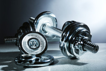 Dumbbells on gray background