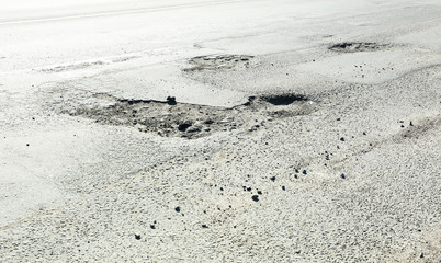 Very bad quality road with potholes