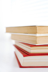 Books on white windowsill, close up