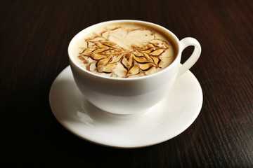 Cup of latte on wooden background