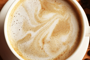 Cup of coffee latte art, closeup